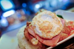 Ham, fried egg and pork chop on rice